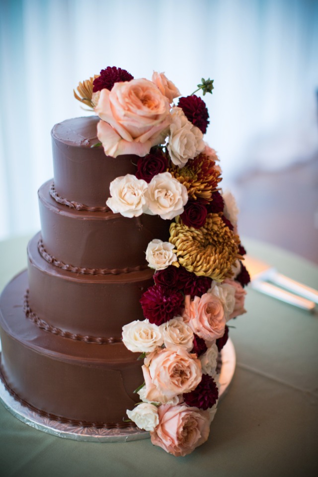 chocolate cake with flower garland topper