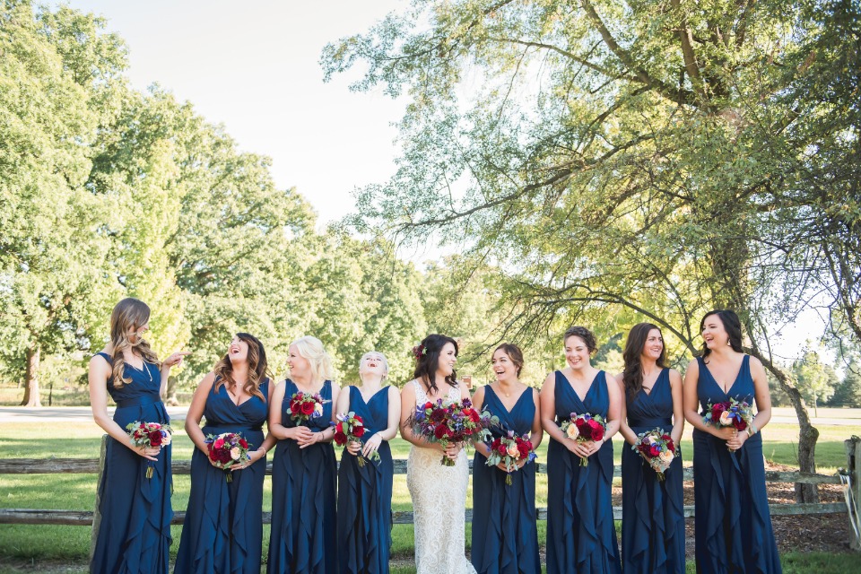 Blue dress and red bouquets are gorgeous