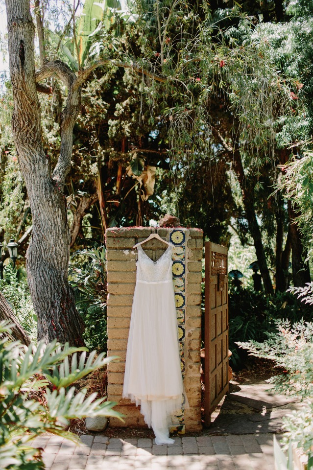 Summer wedding dress with flowy skirt and sparkly top