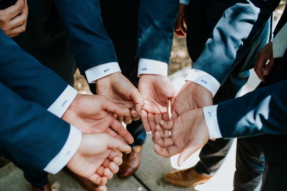 Embroidered groomsmen cuffs with their initials 