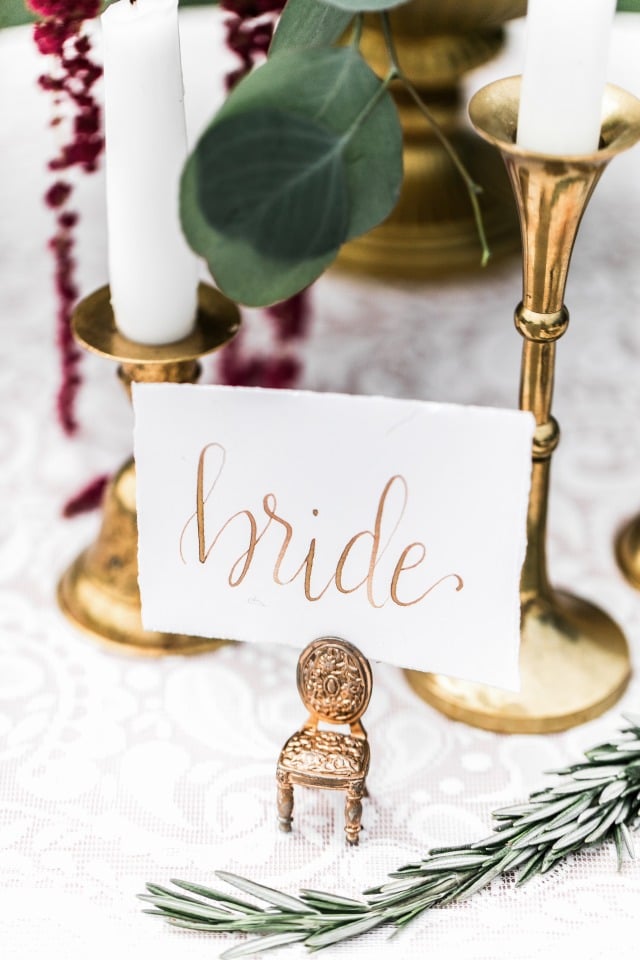 Gold calligraphy place card for the bride