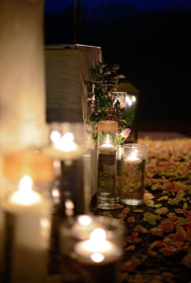 glowing candle lit and floating candle aisle decor