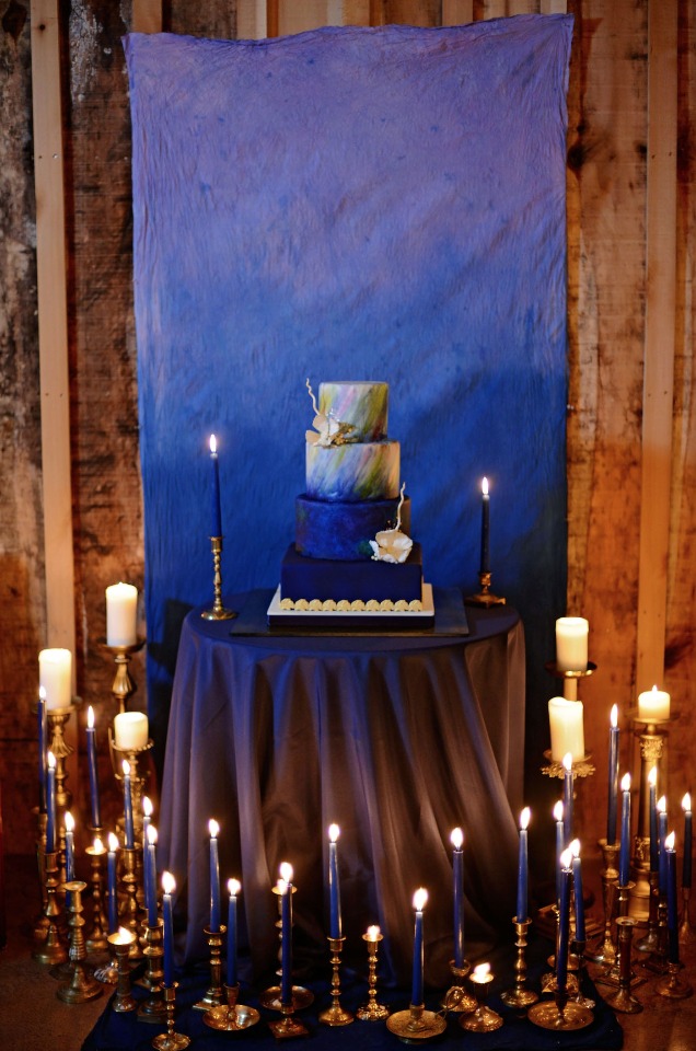 night time wedding cake and candle lit table