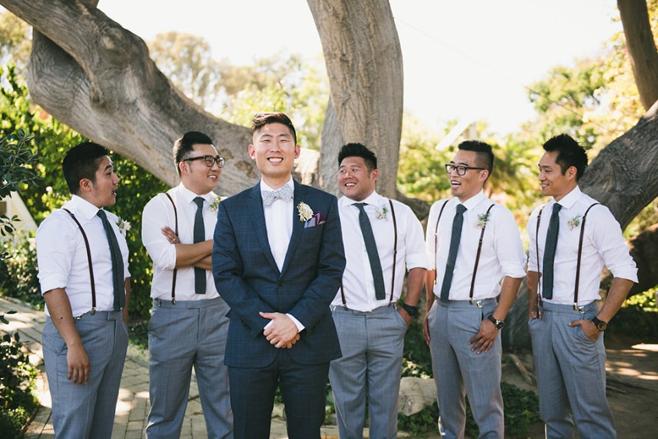 blue and white groomsmen with suspenders