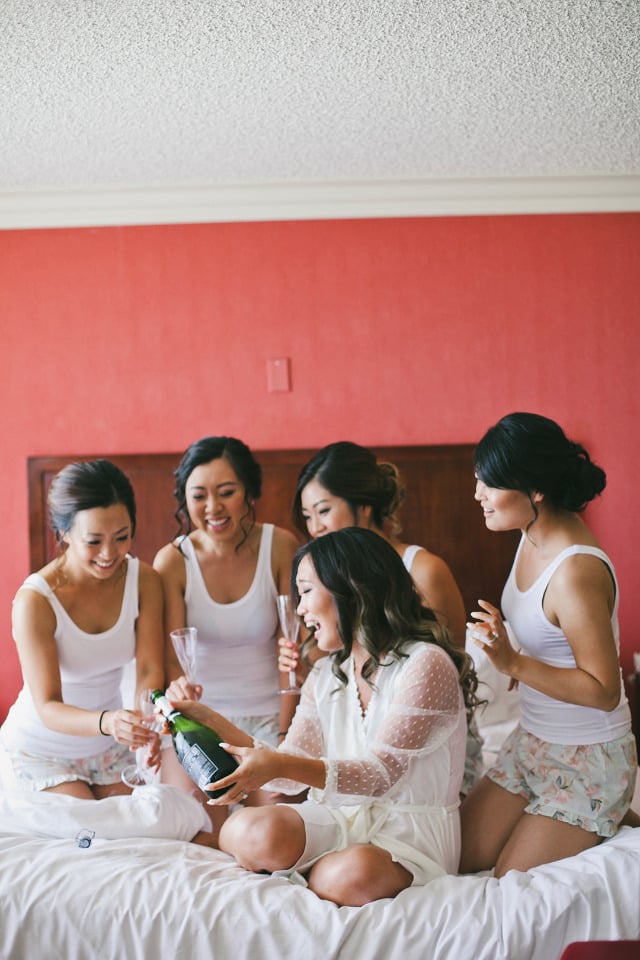 getting ready with bridesmaids and champagne