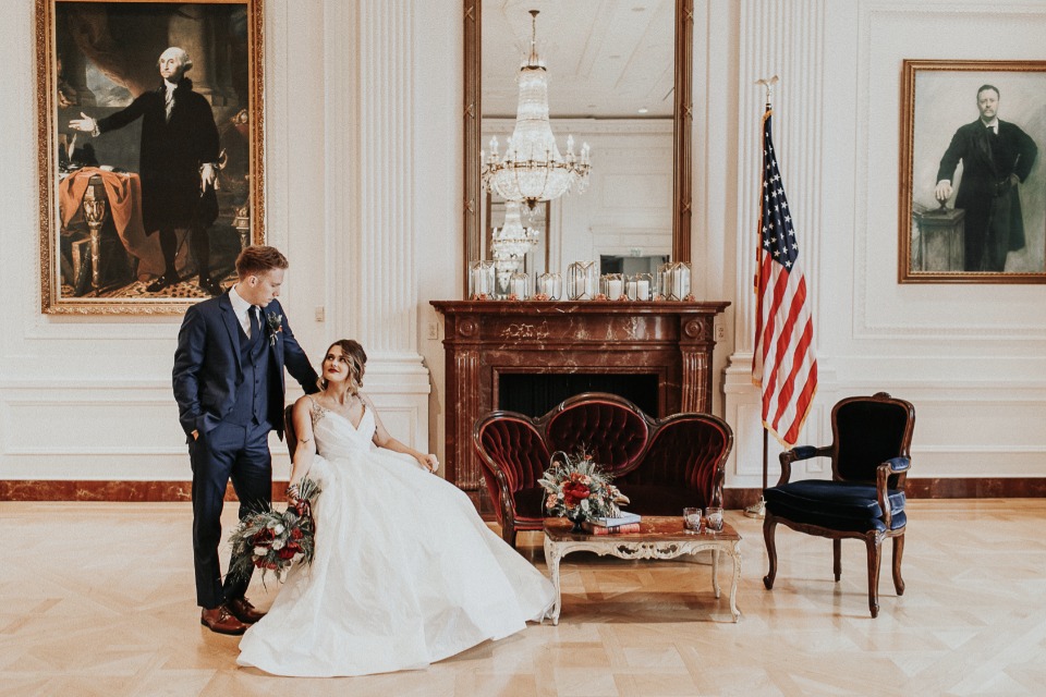 Elegant wedding portrait in historic building interior