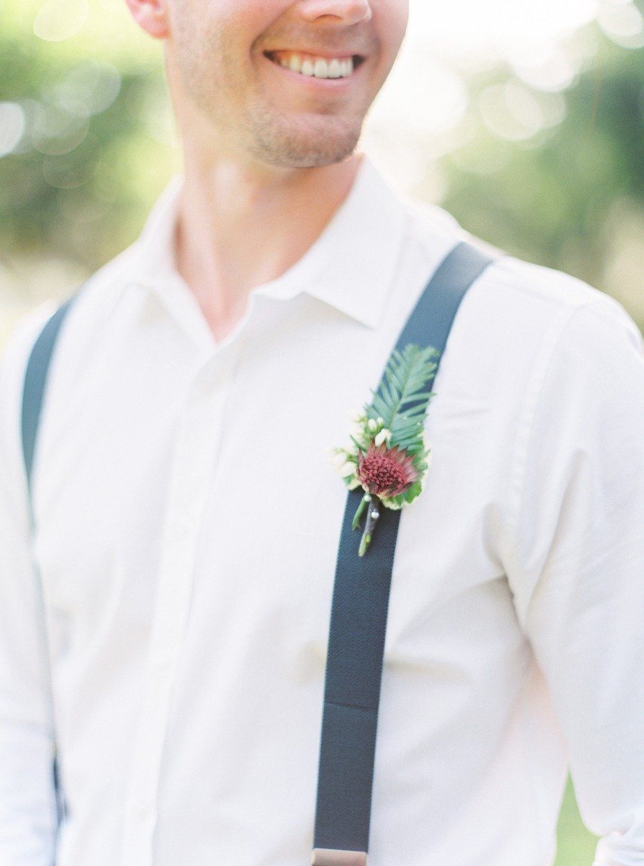 Greenery boutonniere and suspenders