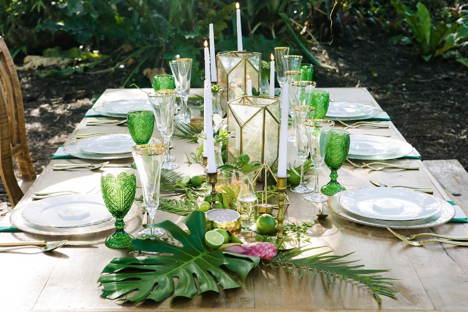 green and gold wedding table with a tropical vibe