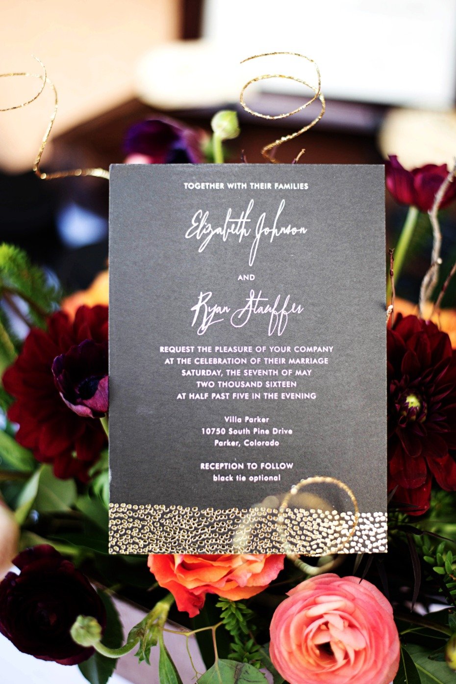 wedding invitation in black and gold