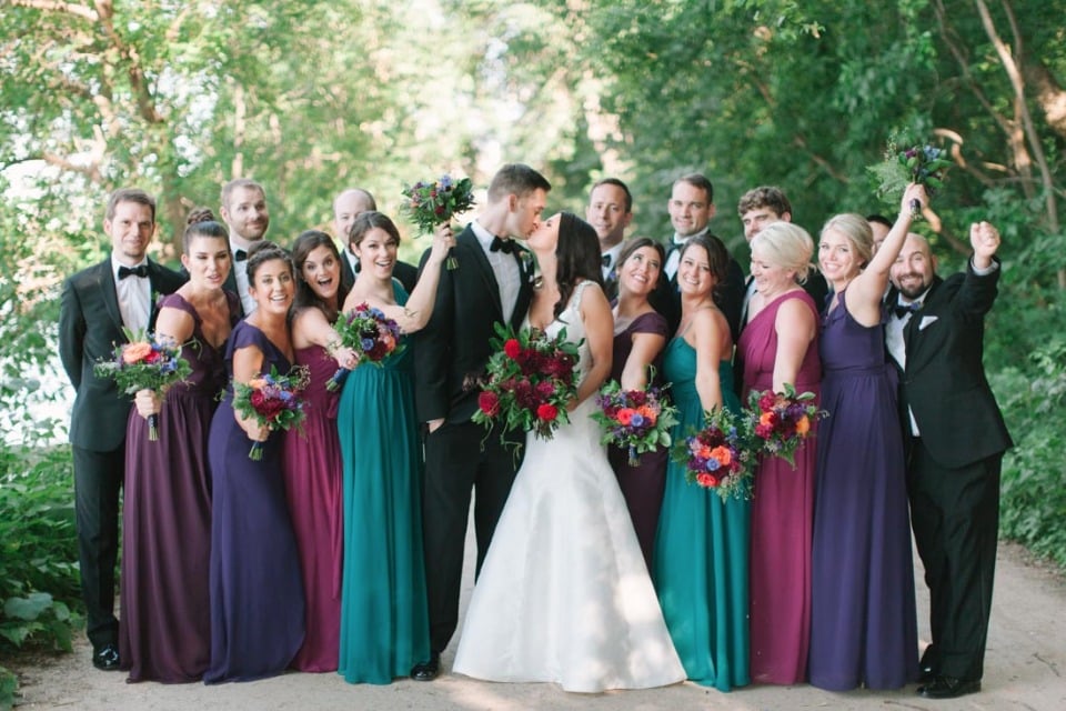 wedding party in jewel tones and tuxedos