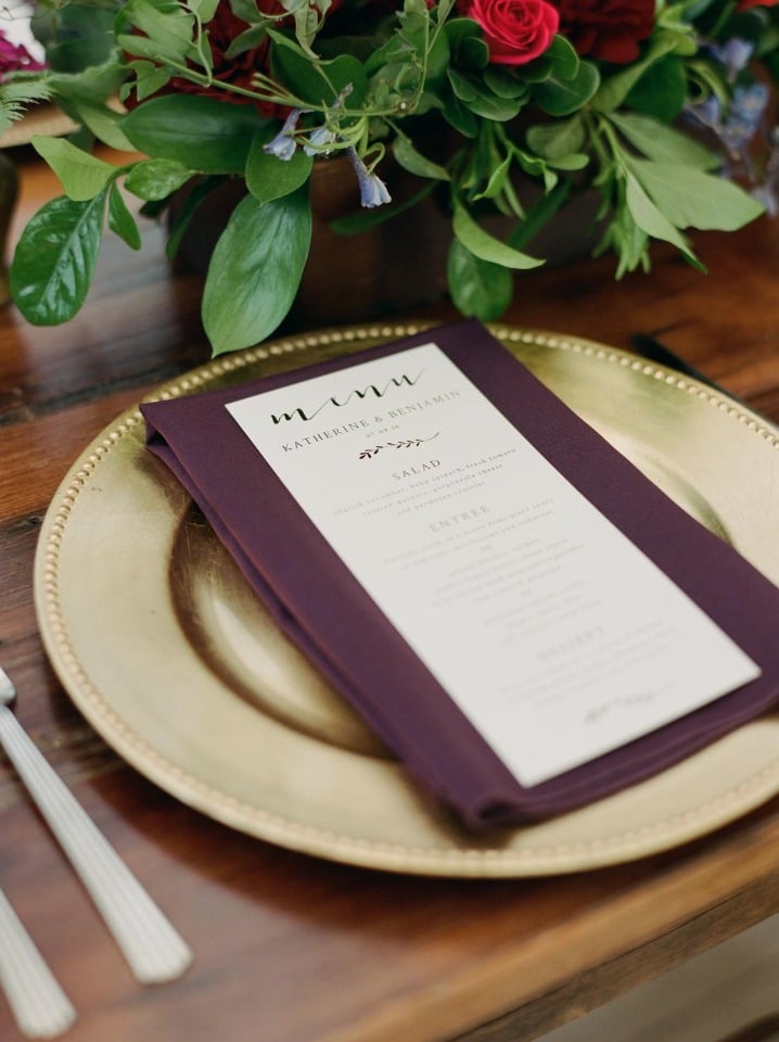 gold and burgundy wedding place setting