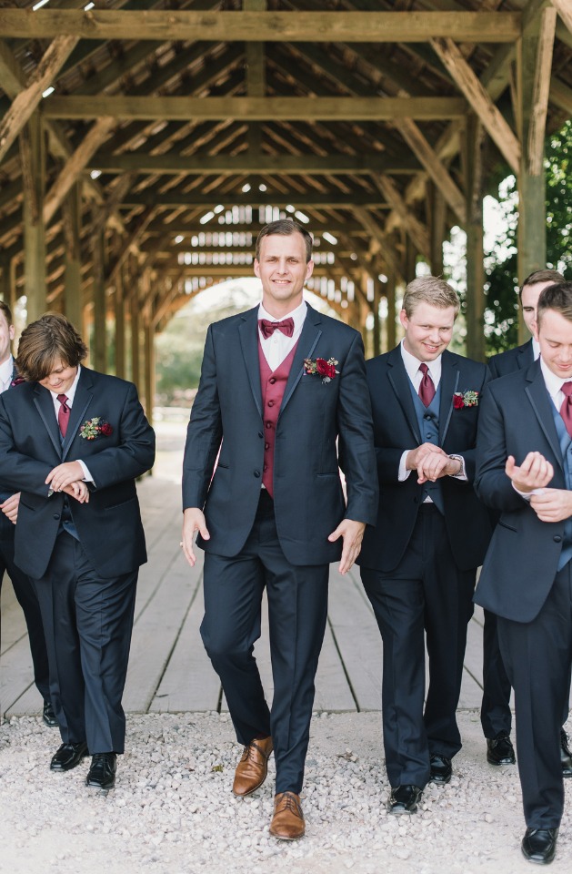 groom and his men in charcoal and burgundy suit