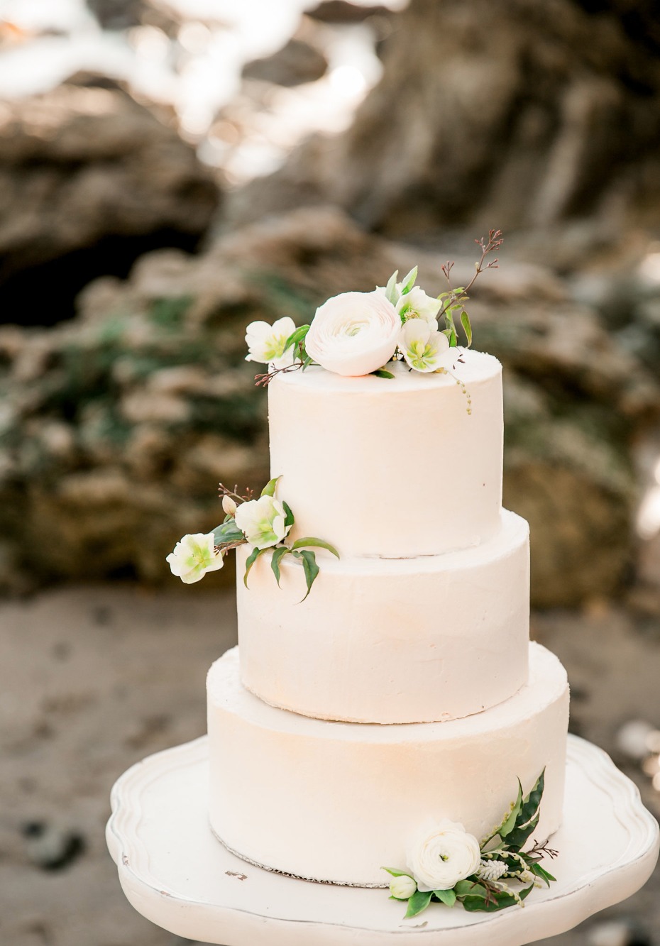 modern chic wedding cake topped with flowers