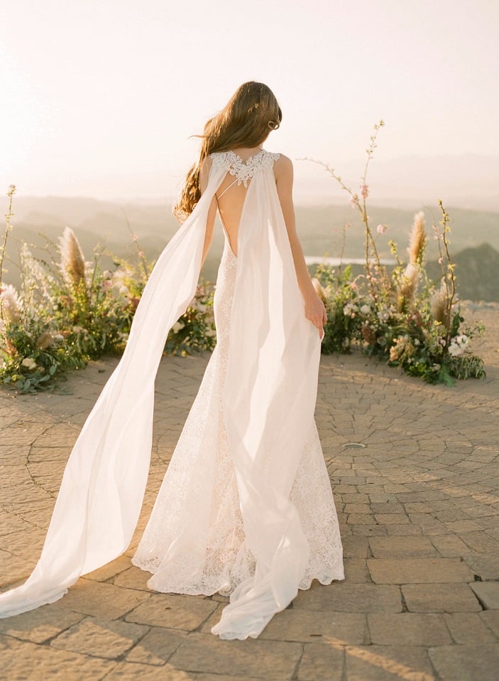 detachable cape on this lace wedding gown from Claire Pettibone