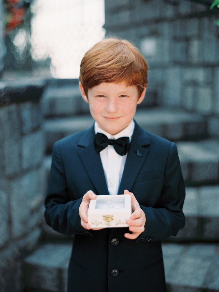 ring bearer in suit and bow tie