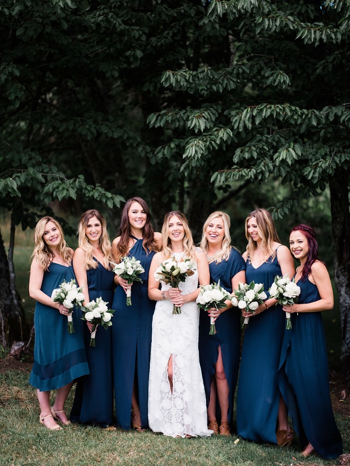 bridesmaids in mismatched blue dresses