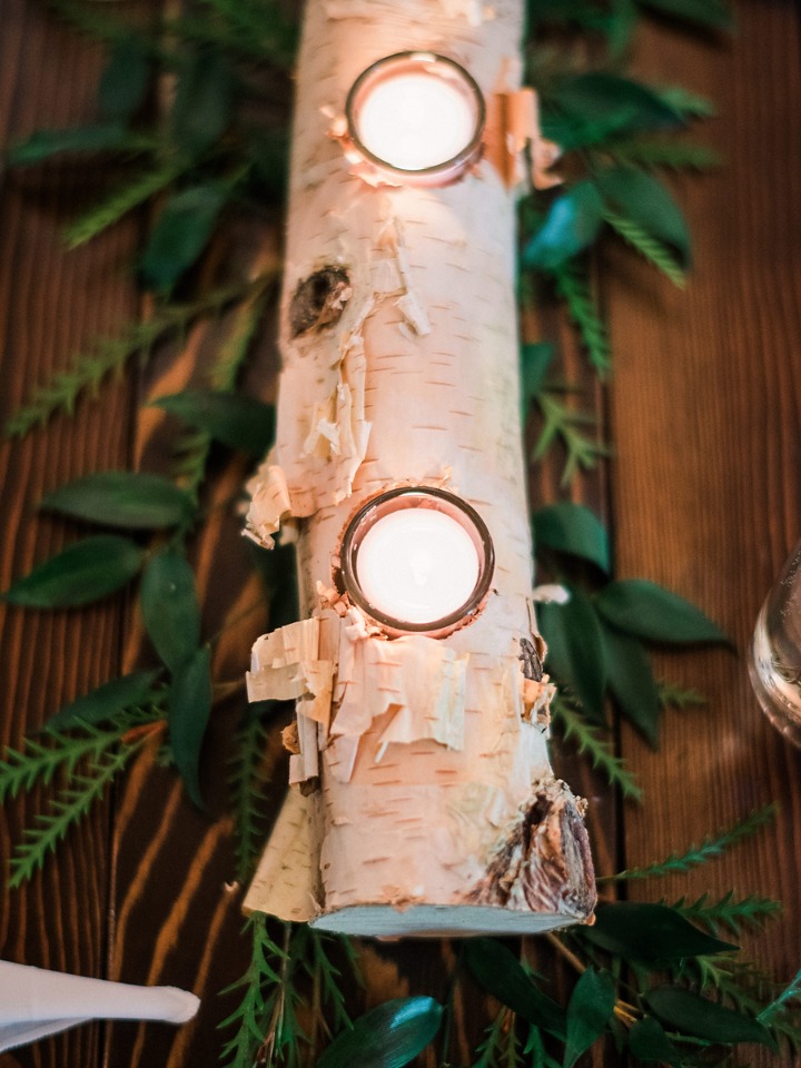 birch log and greenery centerpieces