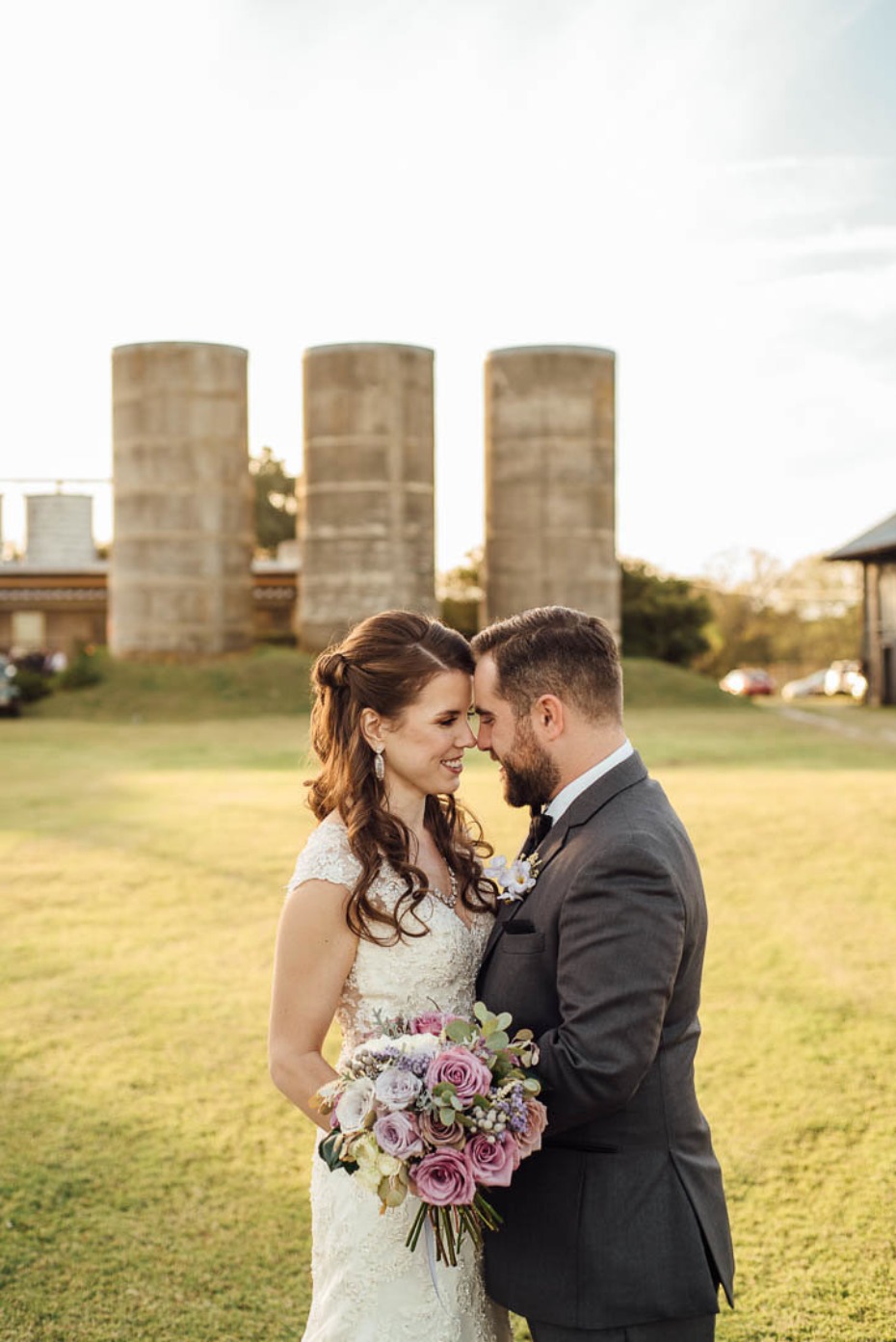 Green and purple fall outdoor wedding amongst the silos