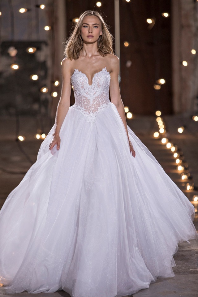 Woman wearing a beautiful white strapless wedding gown