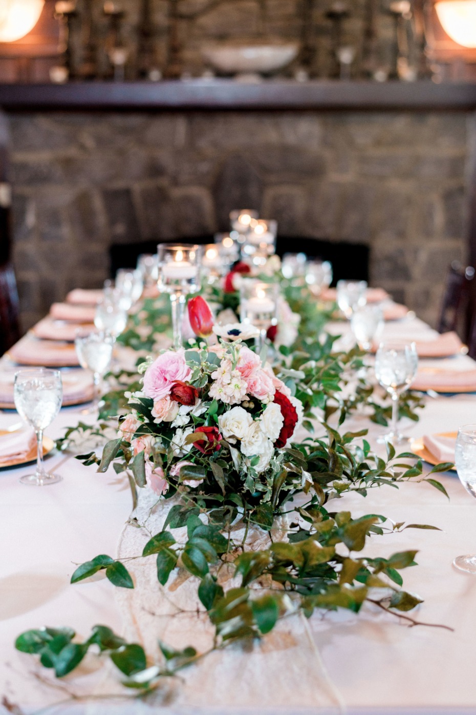 ivy garland and pink and red floral centerpiece