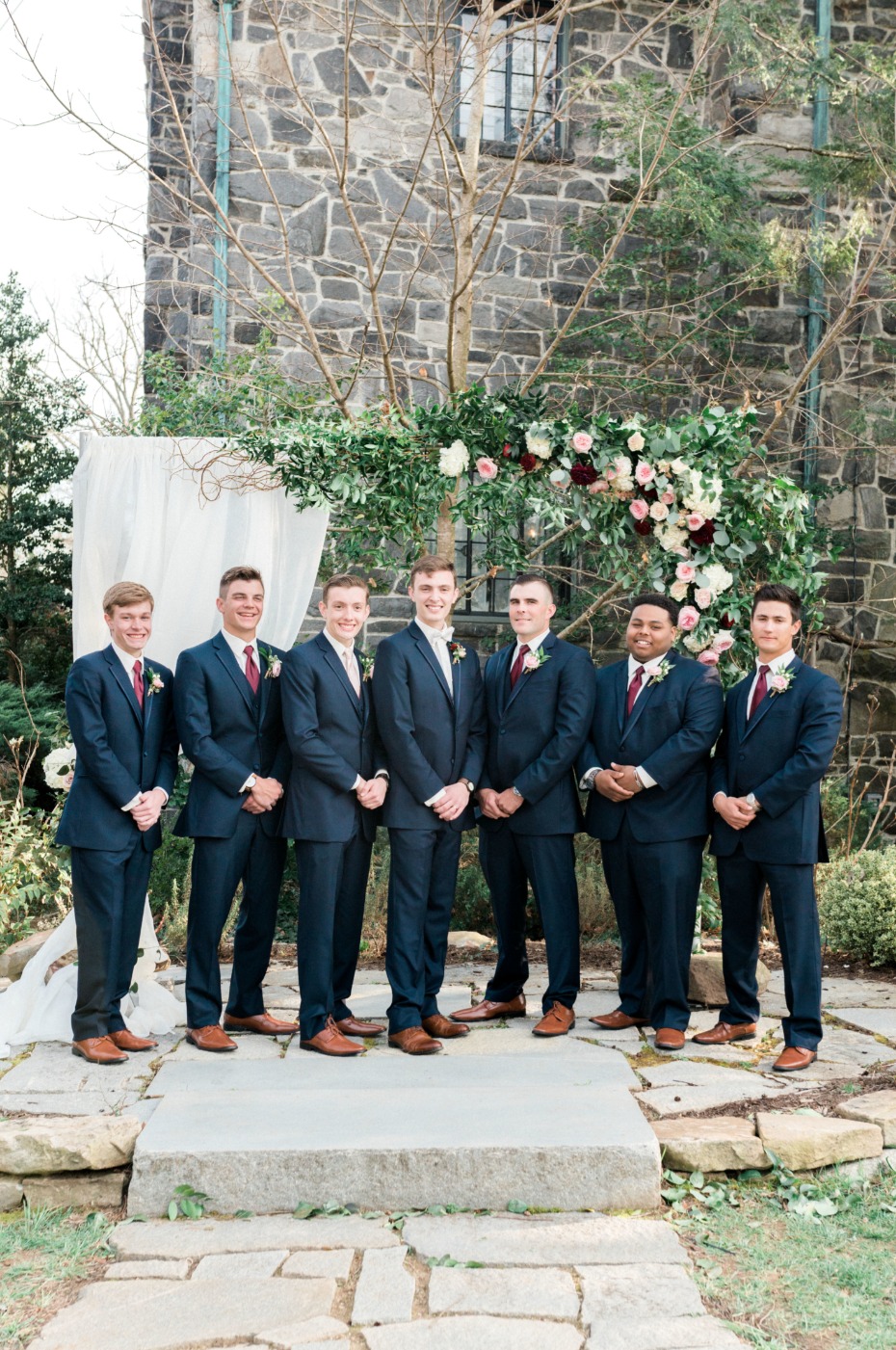 groom and his groomsmen in navy suits