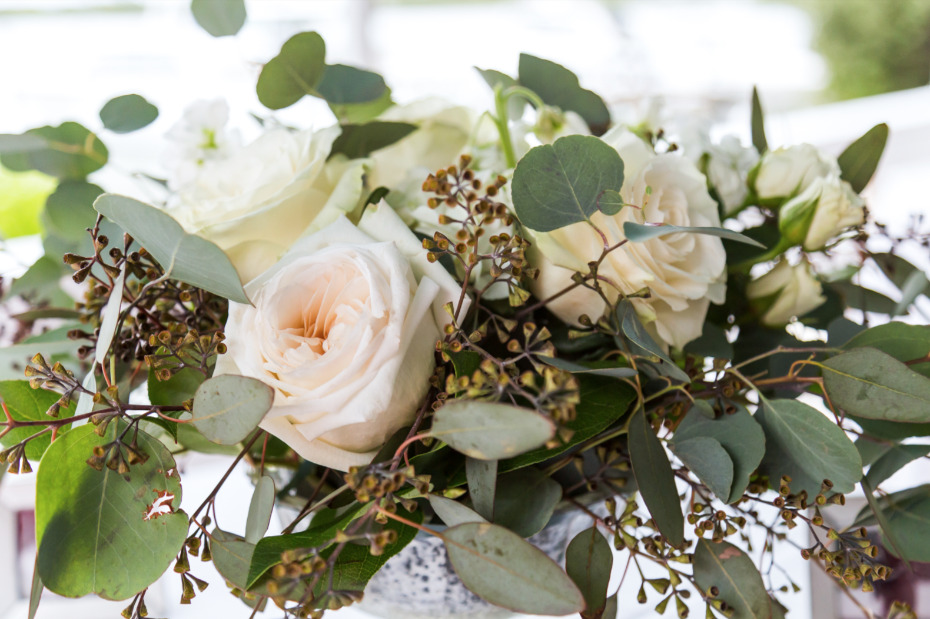eucalyptus, Italian ruscus, off-white garden roses, ranunculus and spray roses wedding centerpieces