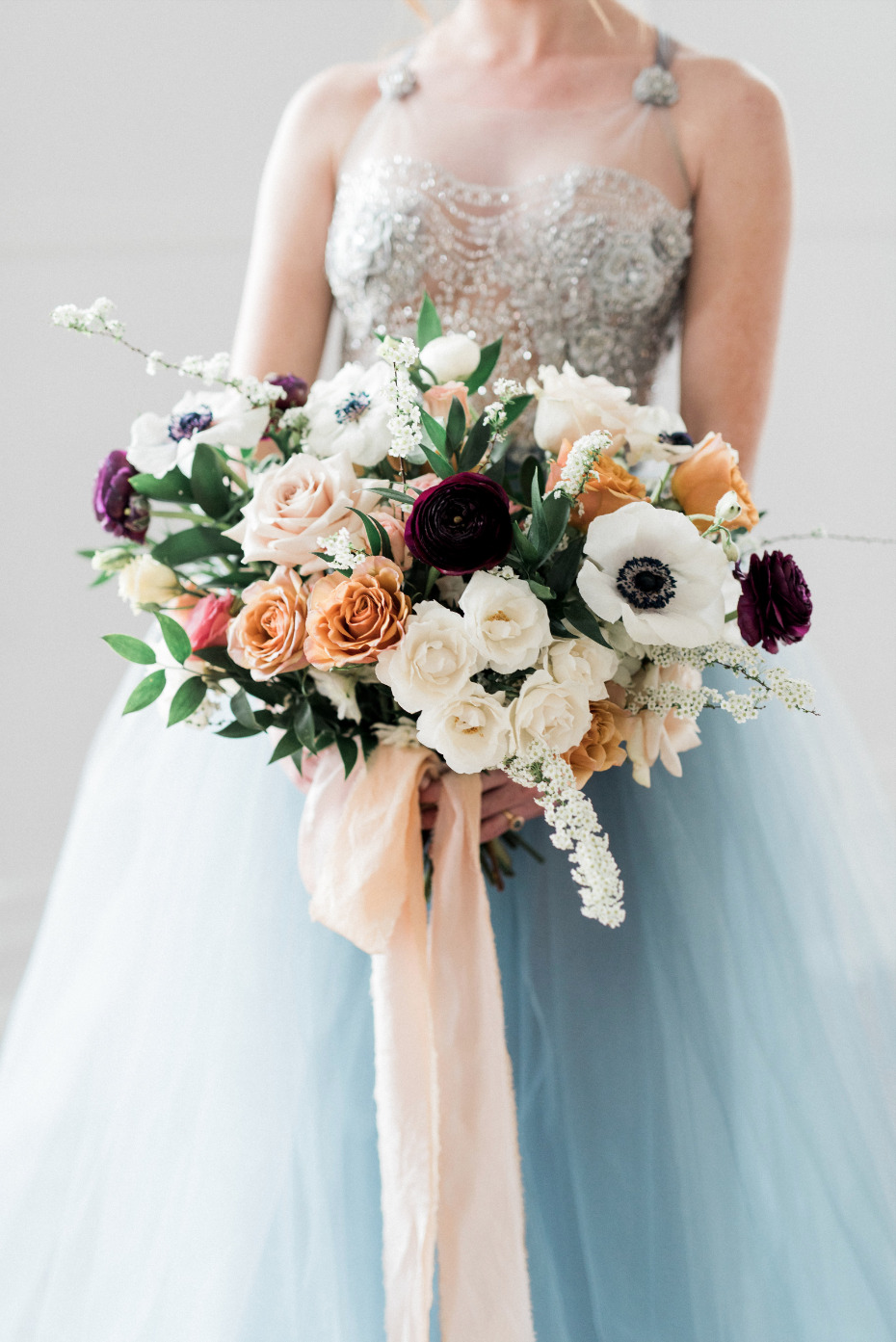 anomone wedding bouquet mixed in with roses