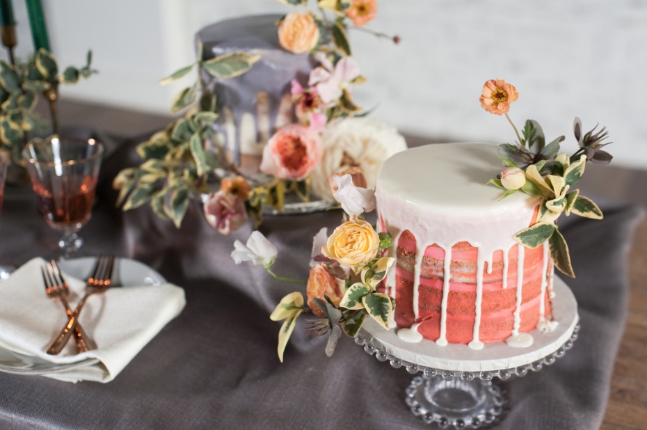 wedding cakes with drizzle frosting accented with flowers