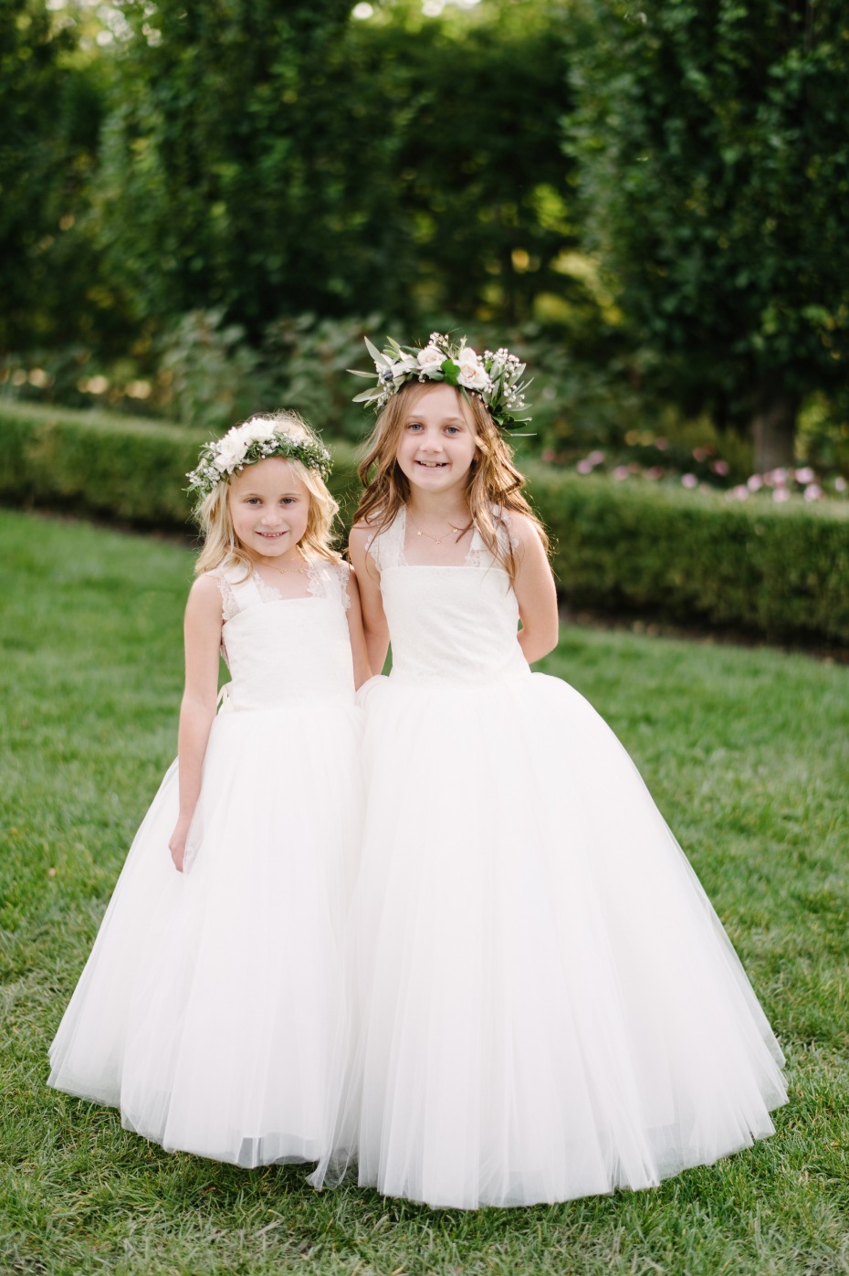 flower girls in white and flower crown