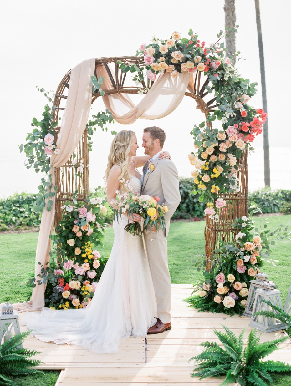 Colorful rose arbor with draping fabric