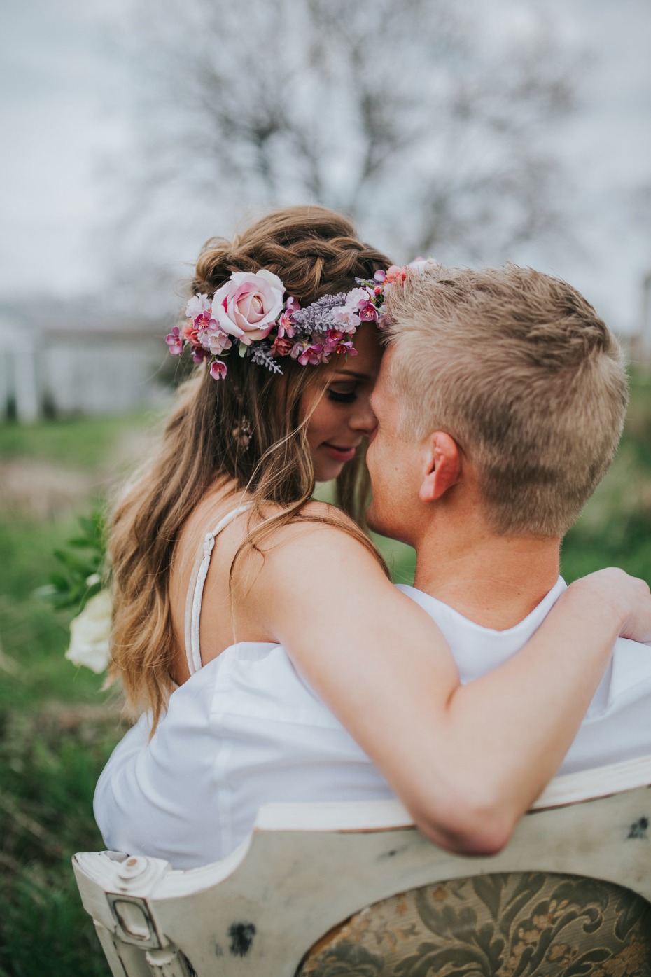 Romantic couple portrait with flower crown outdoors