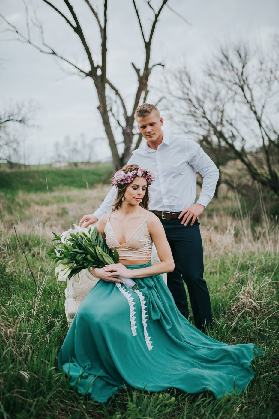Romantic outdoor wedding portrait of couple in field