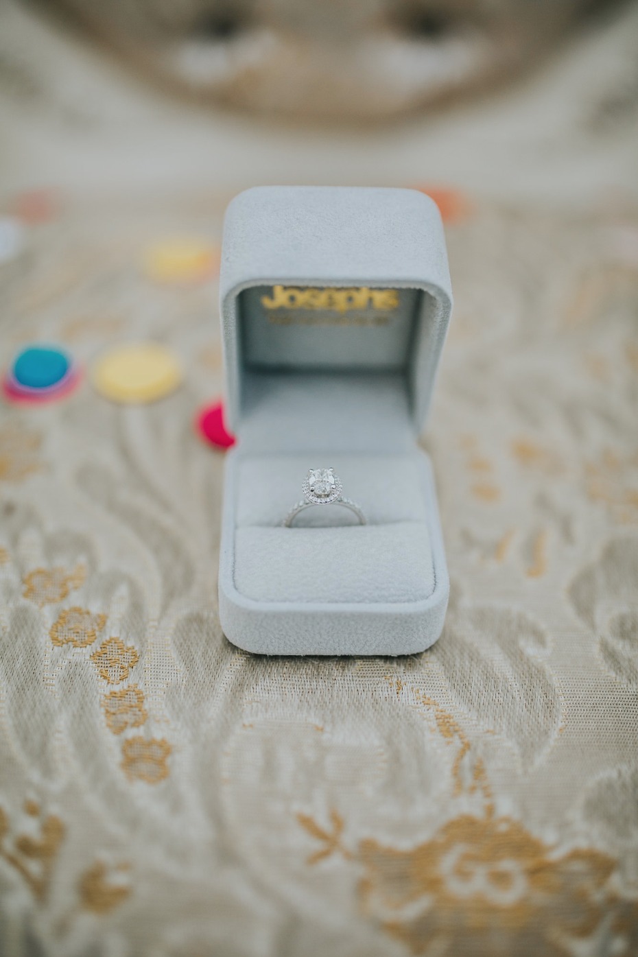 Diamond engagement ring in a light blue jewelry box