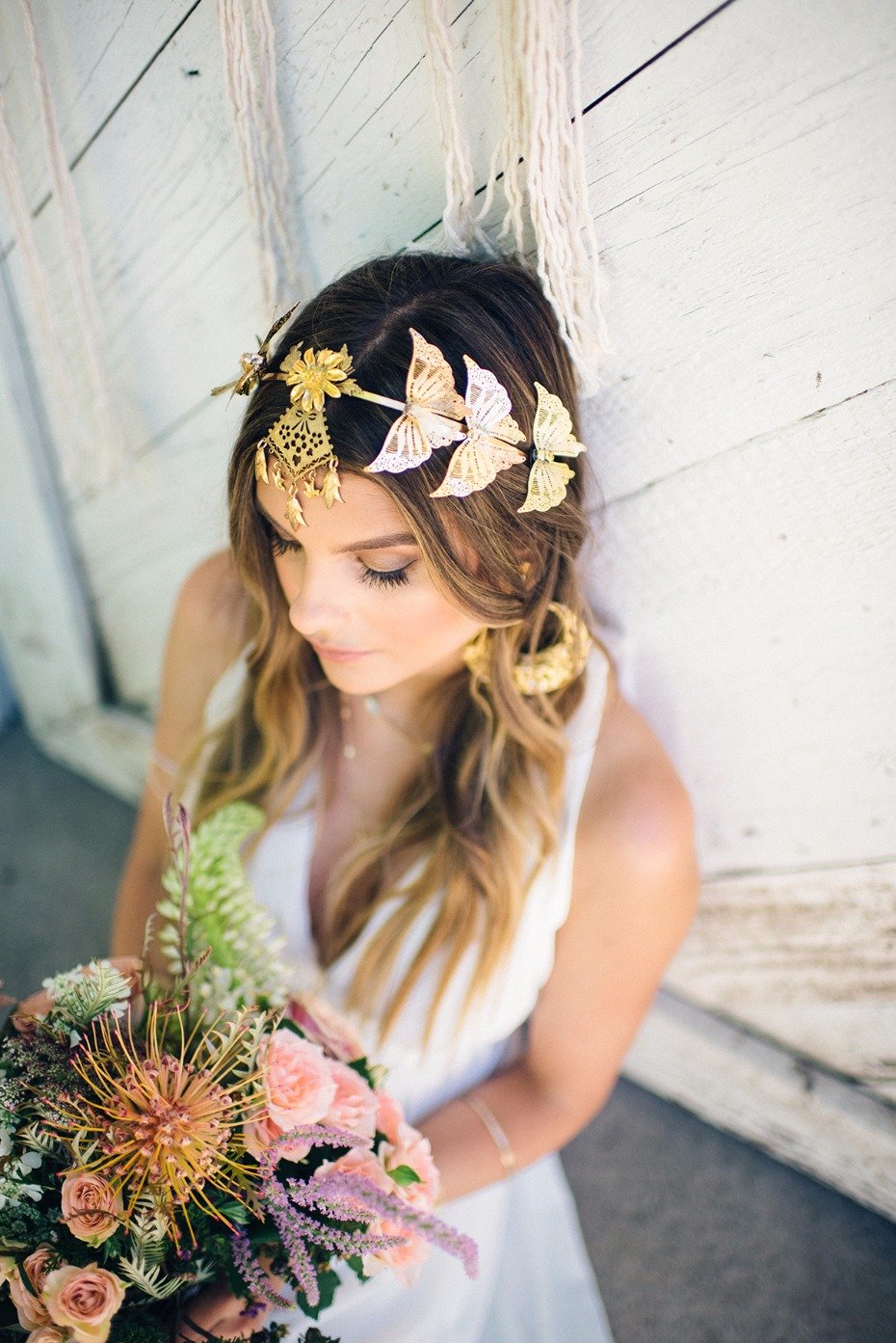 butterfly headpiece and tropical wedding bouquet