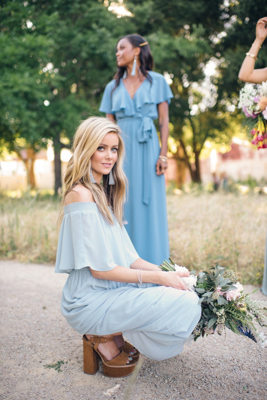 bridesmaid in chunky platforms and blue bridesmaid dress from Show Me Your Mumu