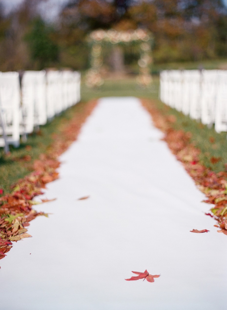 wedding aisle bordered with fallen leaves