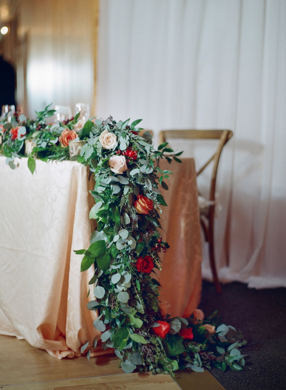 floral garland decorated sweetheart table