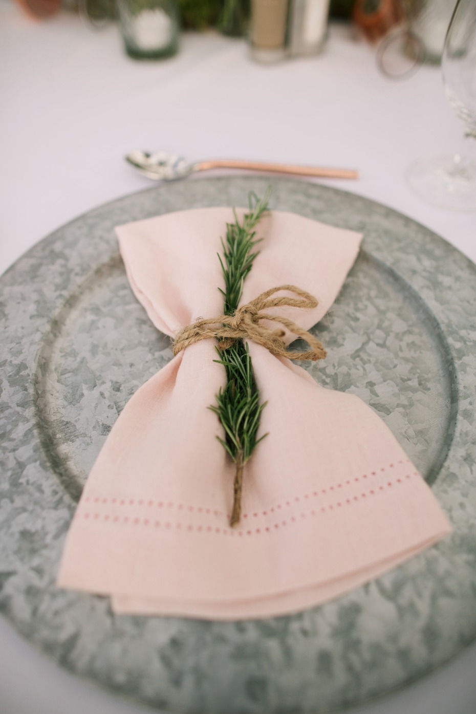 Simple place setting with a sprig of greenery