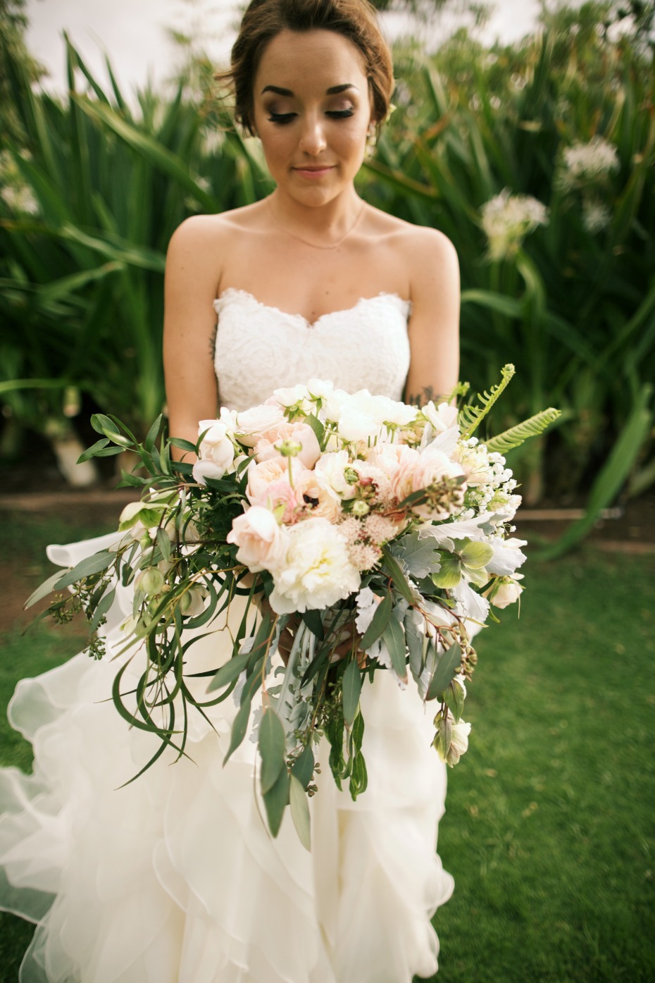 White and blush bouquet with loose greenery