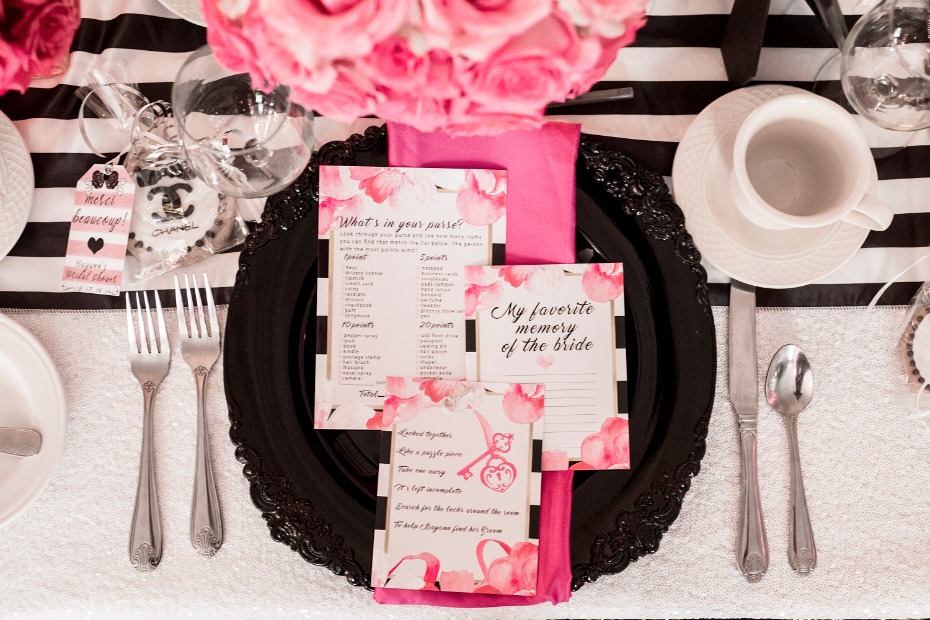 Elegant pink bridal shower table setting with party games