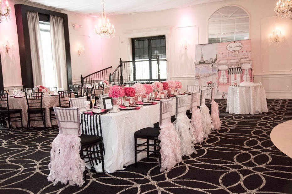 Elegant Paris themed event space with pink florals