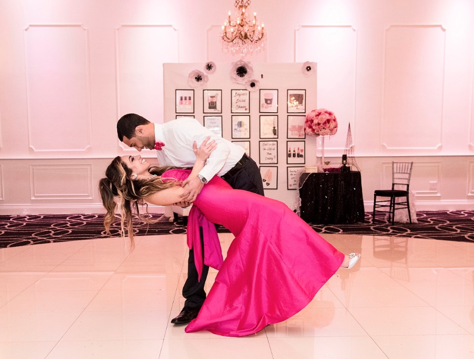 Couple dancing at a pink themed party celebration
