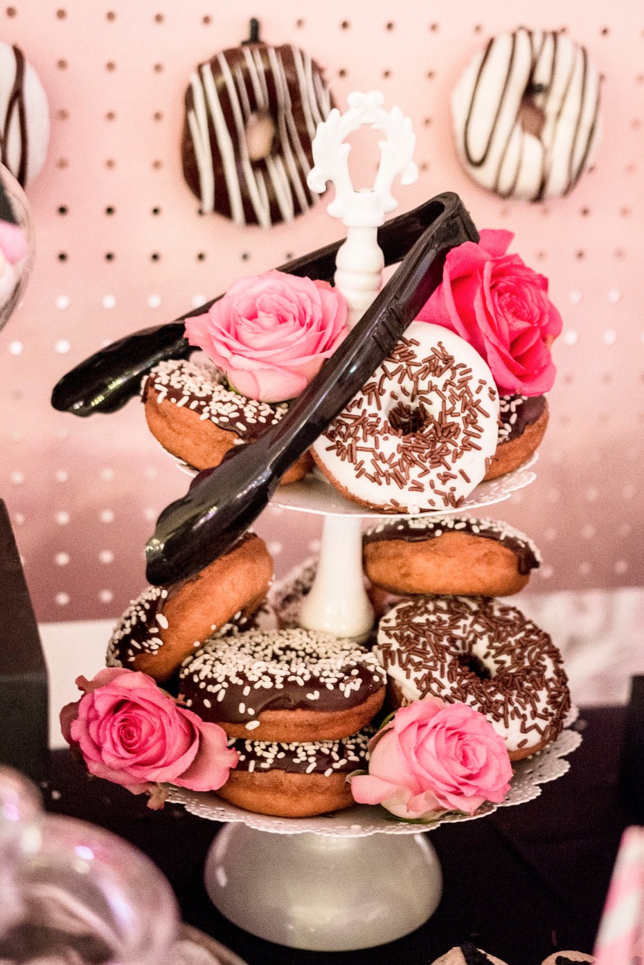 Donut tower with pink roses and chocolate sprinkles