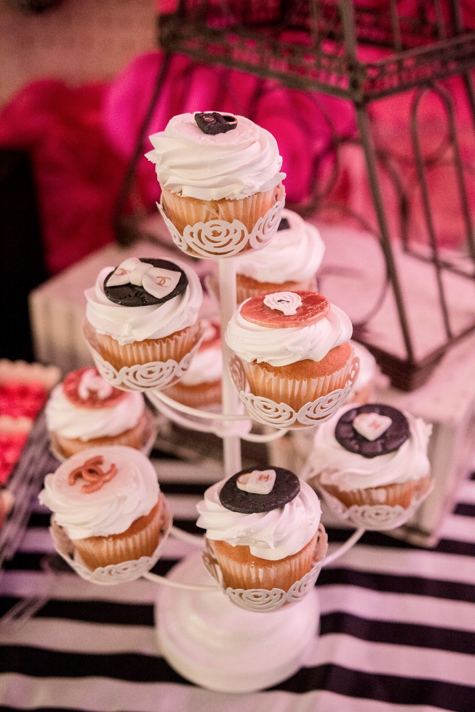 Decorative cupcakes displayed on a tiered dessert stand