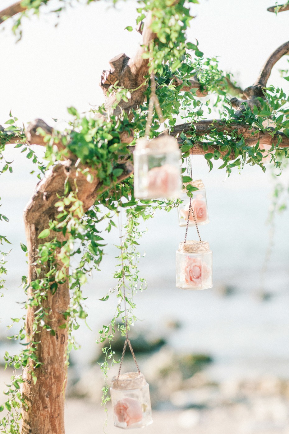 rustic boho chic wedding arch with hanging roses