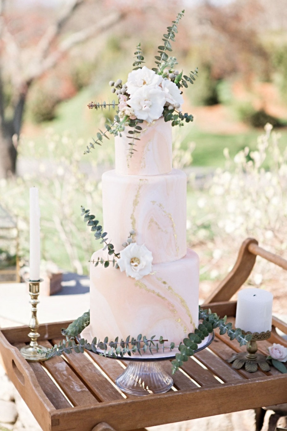 Peach sorbet wedding cake with floral topper