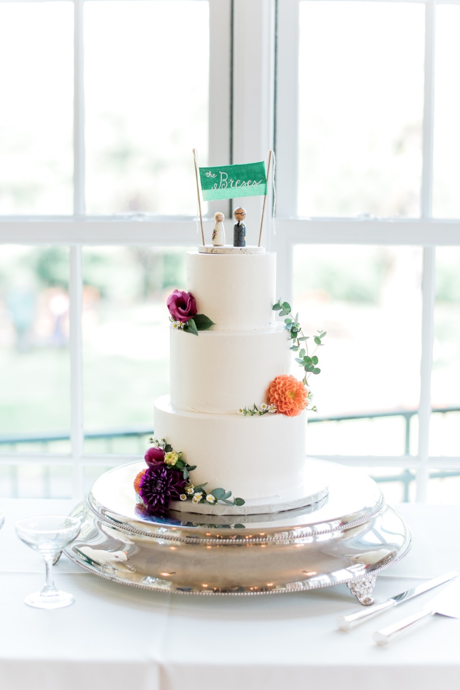 simple floral accented wedding cake