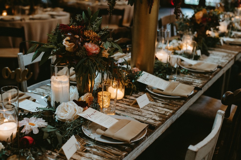 Rustic tablescape with candles and fall florals