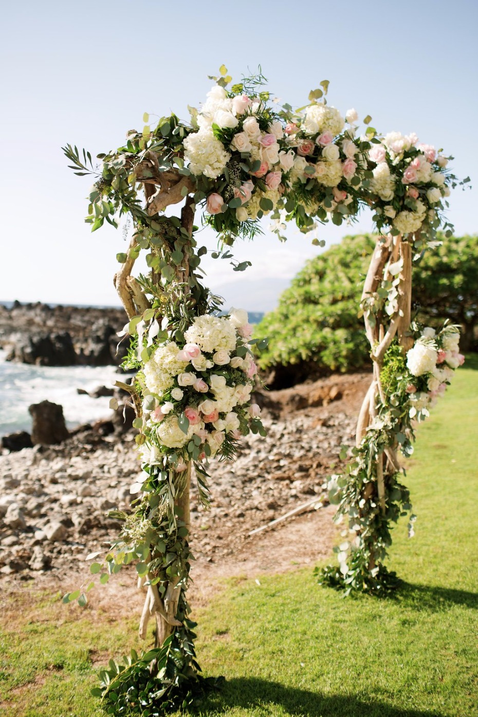 pink and white floral wedding arch