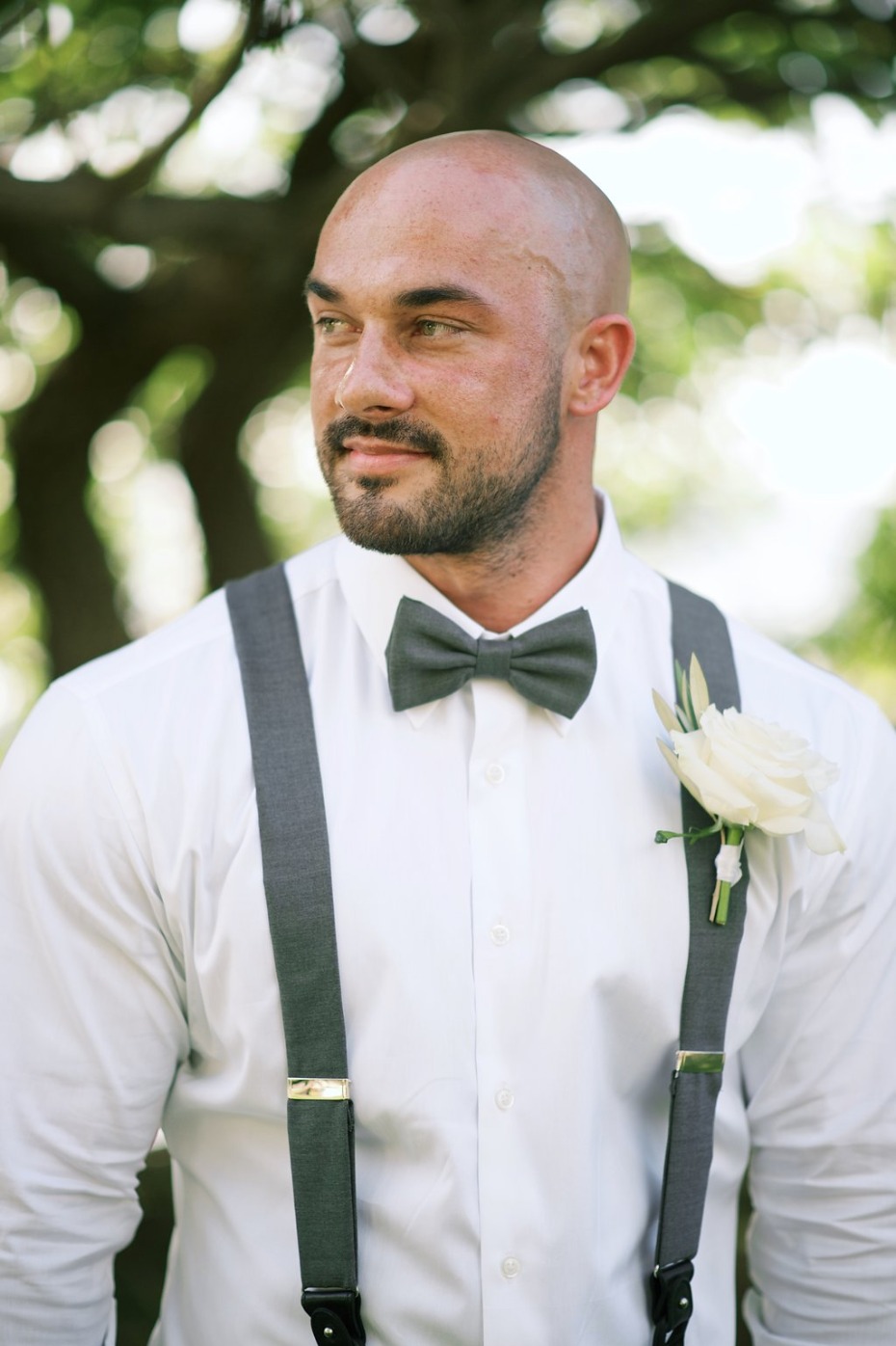 grey bow tie and suspender groom look